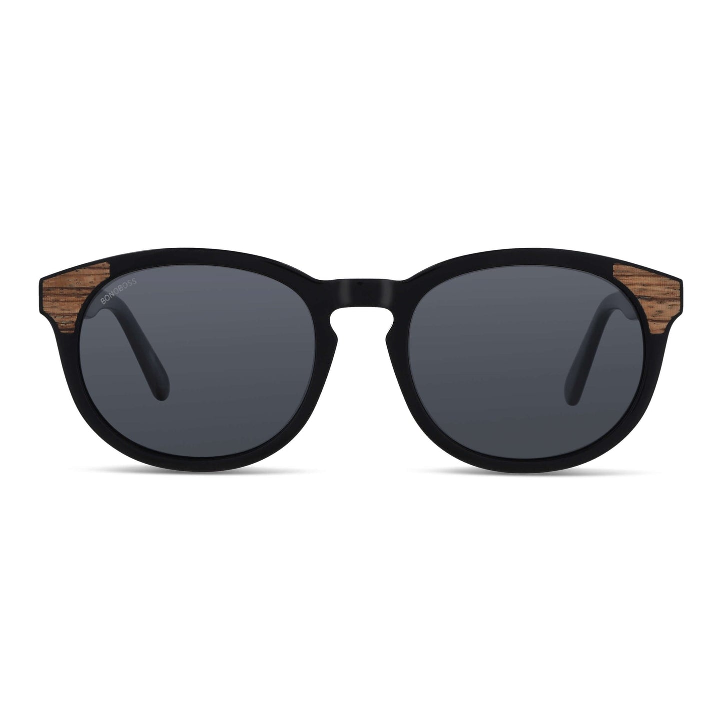 lentes de sol polarizados para hombre y mujerovalados de color negro con patas de madera natural sustentable. Marco de plastico reciclado con lentes polarizadas #color_negro
