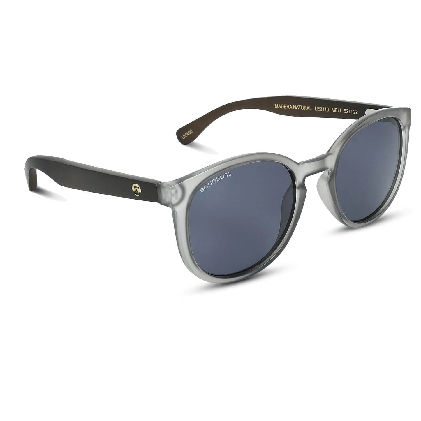 anteojos redondos de plástico reciclado y varillas de madera natural sustentable con lentes de color negro. Polarizadas y forma redonda. La gafa es color transparente #color_negro