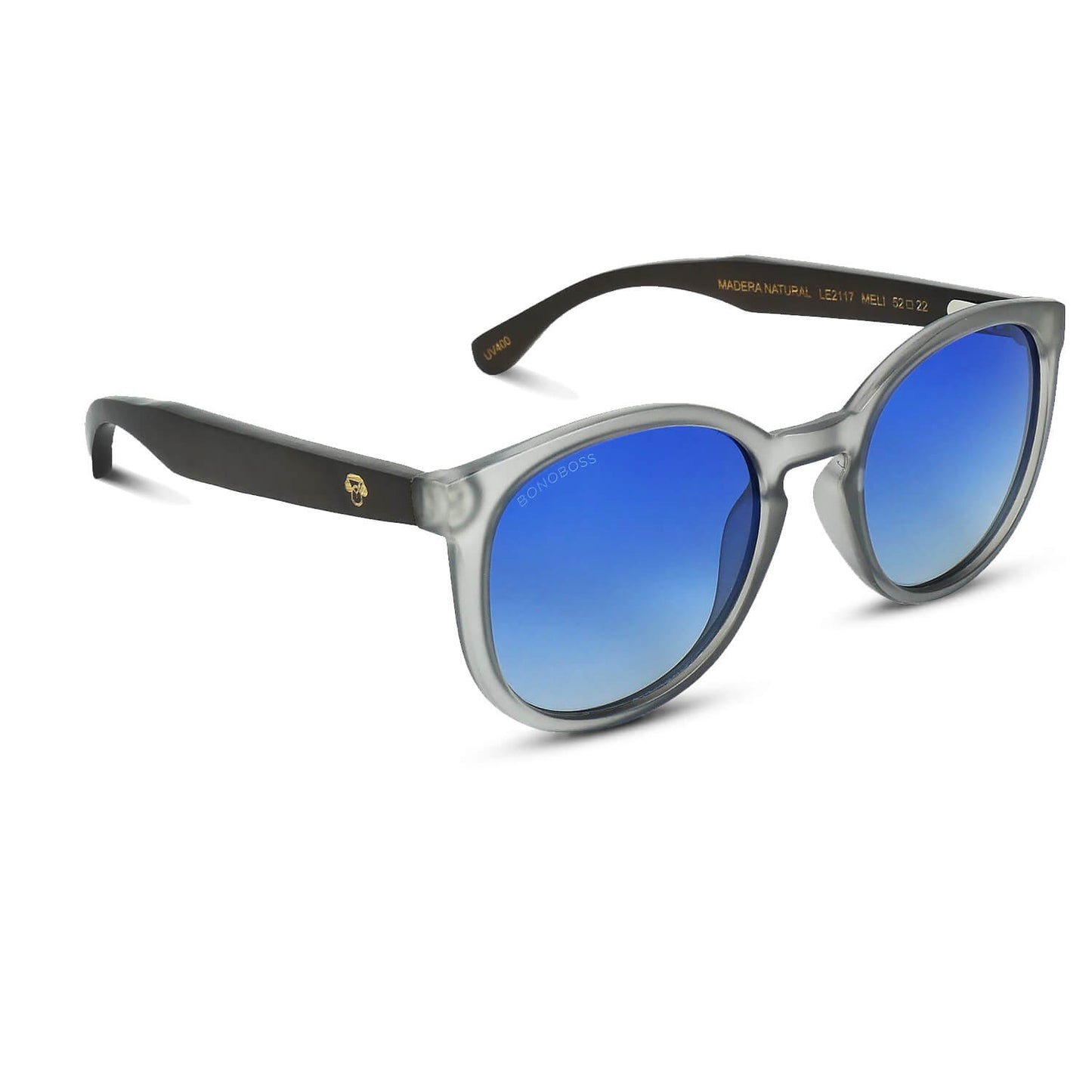 anteojos redondos de plástico reciclado y varillas de madera natural sustentable con lentes de color degrade azul. Polarizadas y forma redonda. La gafa es color transparente #color_degrade-azul