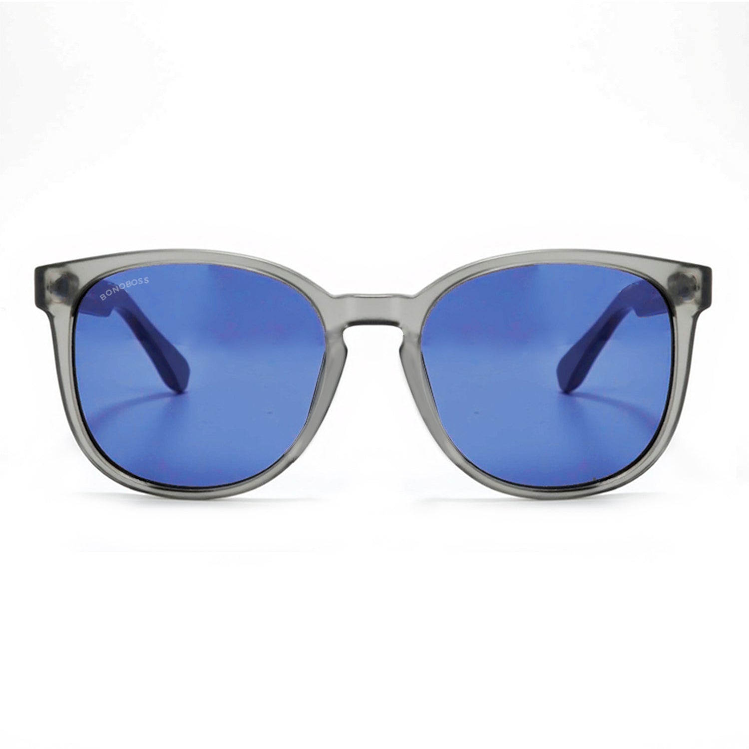 anteojos redondos de plástico reciclado y varillas de madera natural sustentable con lentes de color rosado. Polarizadas y forma redonda. La gafa es color transparente #color_degrade-azul