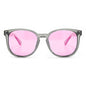 anteojos redondos de plástico reciclado y varillas de madera natural sustentable con lentes de color rosado. Polarizadas y forma redonda. La gafa es color transparente #color_rosado