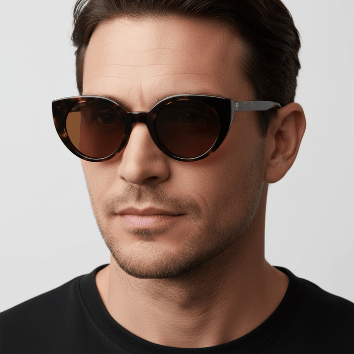 Un men wearing eyeglasses agate pattern tortoise bonoboss in side view #color_carey
