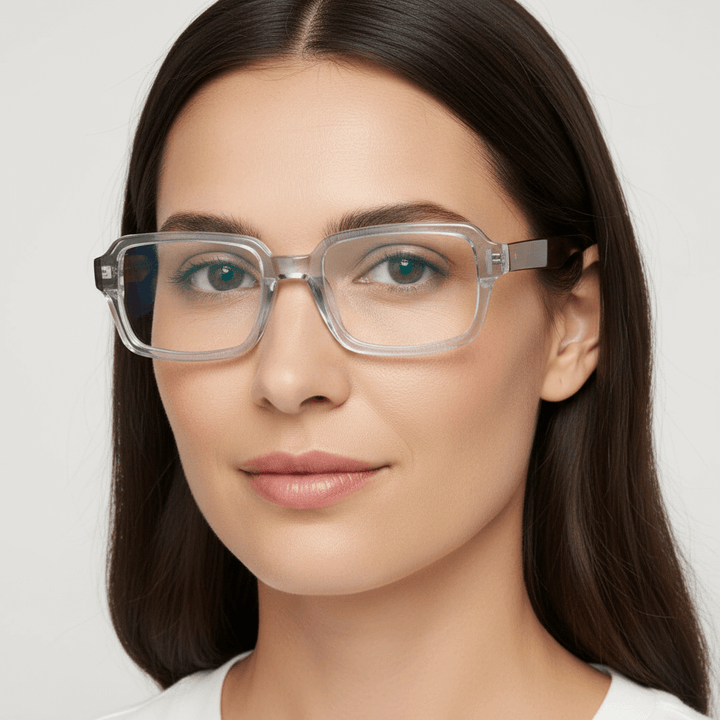 La side view a women round face wearing frames optical bonoboss forma rectangular clear #color_crystal-carey