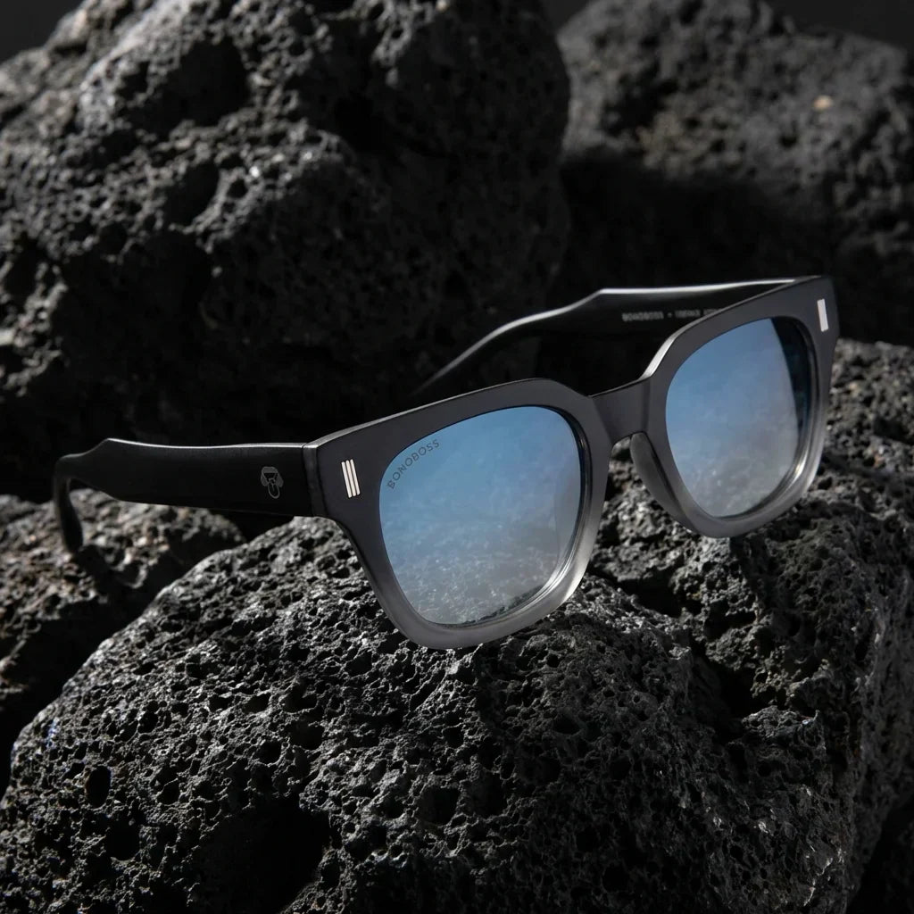 Lentes sol Osorno RPET polarizados reciclado grad black sobre roca volcanica textura natural contraste Bonoboss #editorial_detail1 #color_black