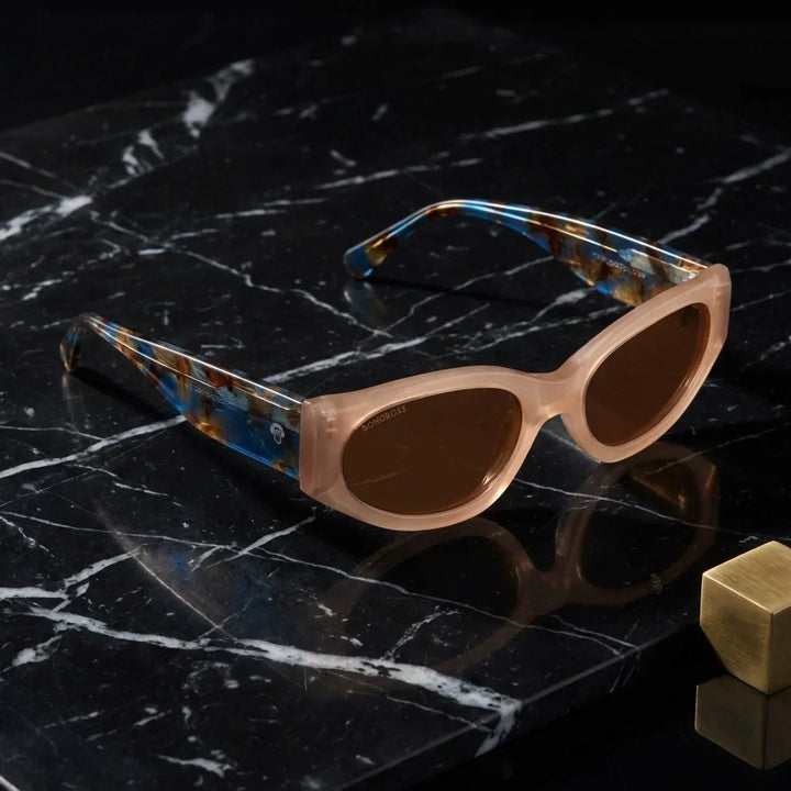 Lenses sun milan polarized UV400 bio-acetate peach sobre marmol black superficie premium elegante contraste bonoboss #editorial_polarizado #color_peach