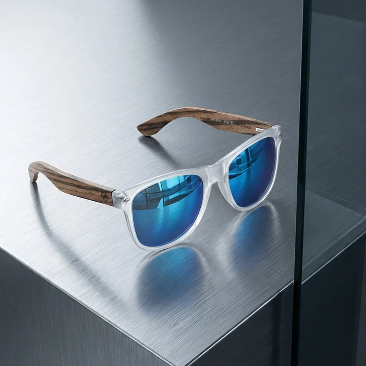 Lenses sun acacia polarized UV400 wood zebrawood clear mirrored blue sobre brushed metal industrial surface bonoboss #editorial_grid1 #color_transparente-espejado-azul