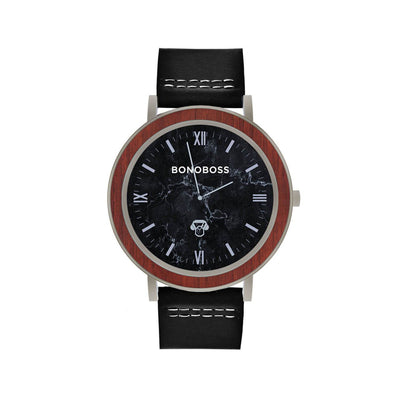 reloj de acero inoxidable plateado con correa de cuero intercambiable negra y fondo negro