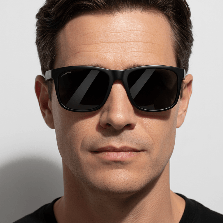 La front view a men wearing eyeglasses sunglasses polarized recycled plastic with color lenses black and marco de Bonoboss #color_dark