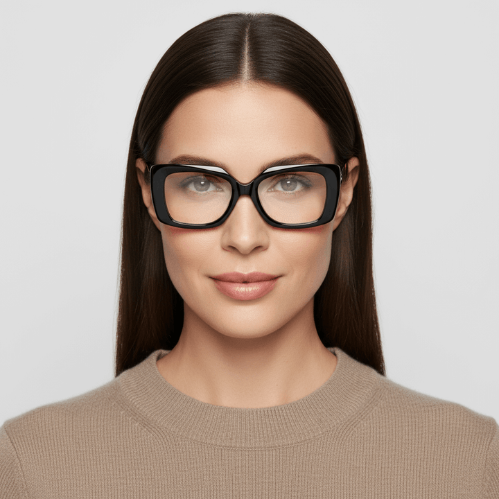 La front view a women cara ovalada and pelo liso largo suelto wearing unos frames optical frames sustainables in acetate recycled bonoboss forma rectangular oversized larges de #color_negro