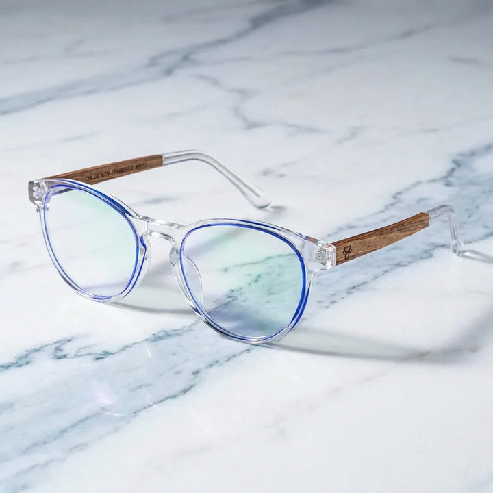 Lenses optical chiloe naranja sobre mármol white elegante frame premium bonoboss #editorial_armazon #color_naranja