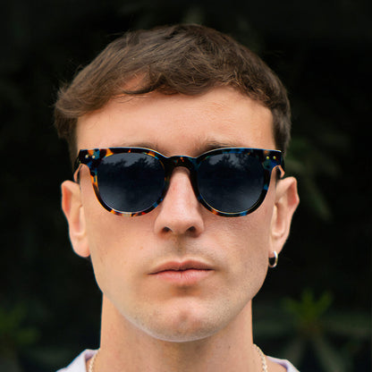 lentes redondos grandes polarizados de sol hombre mujer con receta vista laterla color azul #color_azul-marble